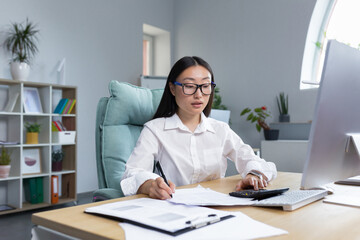 Fototapeta premium Serious thoughtful and confident woman working in office, asian worker businesswoman behind paper work.