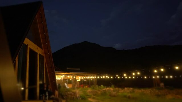  timelapse night sky in glamping. Modern hotel in the mountain resort under the starry sky. High quality 4k footage