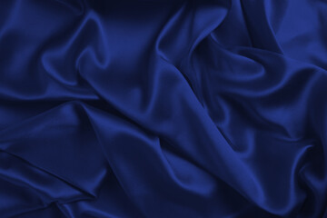 Rich and luxury red silk fabric texture background.