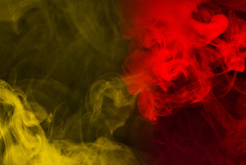 Plakat Yellow steam on a black background.