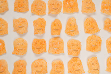 Crispy salted snacks on white background.