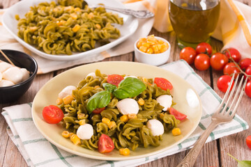 Fusilli pasta with cherry tomatoes and sweet corn.
