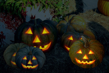 sinister pumpkin jack lantern with glowing eyes in the dark toned design