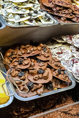 assorted sweets dark and milk chocolate with prunes, pastry counter