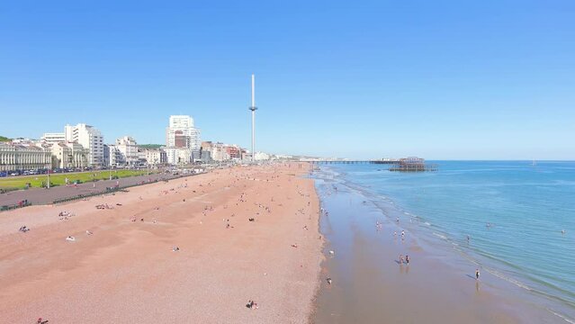 Brighton, UK: Aerial view of city in England, wide beach and blue waters of Atlantic Ocean in seaside resort in summer, sunny day with clear blue sky - landscape panorama of United Kingdom from above