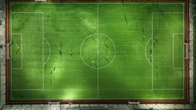Soccer players on a green sports field
