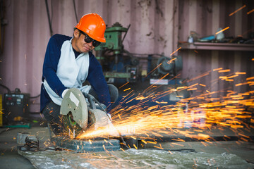 Cutting of a steel with splashes of sparks  in the industrial shop.