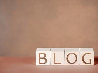 Word BLOG on wooden blocks as a motivation text concept