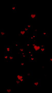 Red hearts motion on black vertical animation background.