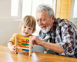 grandchild family child grandparent grandfather abacus mathematic education toy boy fun together...