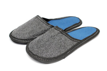 Gray textile slippers with blue insole, house slippers isolated on white background, home clothes