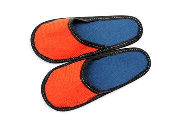 Orange textile slippers with blue insole, house slippers isolated on white background, home clothes, top view