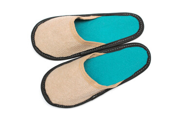 Beige textile slippers with turquoise insole, house slippers isolated on white background, home clothes, top view