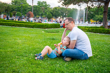 Little cute girl have a fun with father in park near blue mosque in Istanbul, Turkey. 