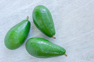 Avocado fruit on white wooden board, Healthy fruit