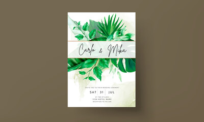 Elegant wedding invitation card with green tropical watercolor