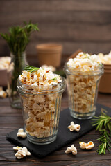 Glasses with popcorn on slate tray on kitchen table