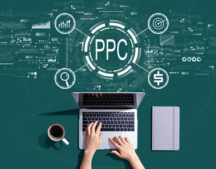 Obraz na płótnie Canvas PPC - Pay per click concept with person using a laptop computer