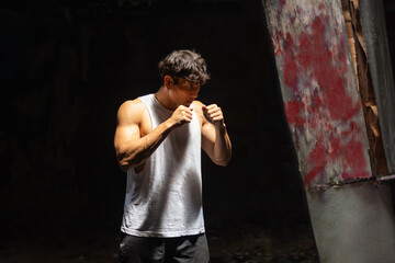 Strong Asian sportsman athlete do combat sport training workout boxing exercise with punching the...