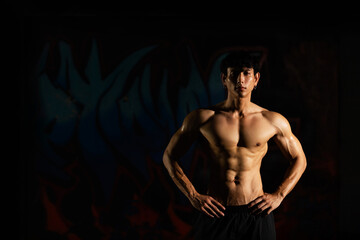 Portrait of Shirtless strong Asian sportsman athlete do sport training workout exercise...