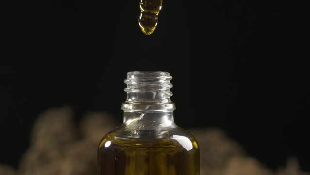 Concept of medical cbd oil treatment and produce. Very close macro view