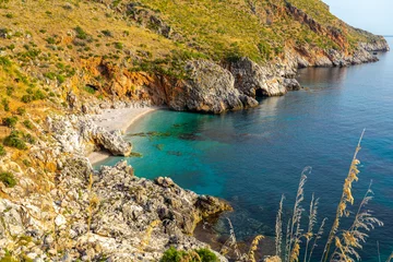 Fotobehang Paradise empty beach with no people and turquoise sea named "Cala Capreria" at the natural reserve “Riserva dello Zingaro”, Scopello, Sicily, Mediterranean Sea, Italy. © Giacomo
