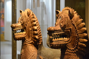 sacred figures in the form of lions made of wood