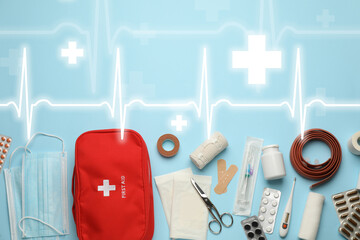 First aid kit and illustration of heartbeat rate with symbols cross on light blue background, flat...