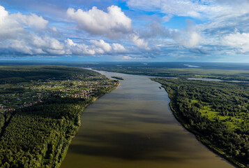 Vasyugan swamp from aerial view. Ob river top view. Pine forest on the river shore. The biggest...
