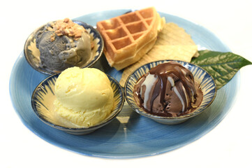 Homemade ice cream with waffle on plate on white background