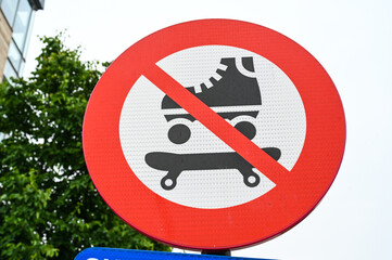 No roller skate sign on the street.  Roller skate prohibition symbol in city.