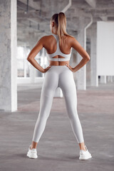 Fototapeta na wymiar Sexy fitness woman. Beautiful athletic girl in leggings