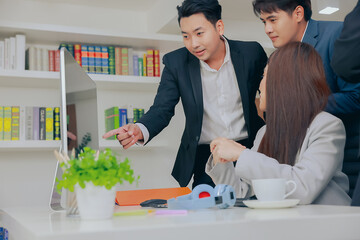 Group of young business people working together in modern office, Business colleague discussing looking and doing video conference on computer