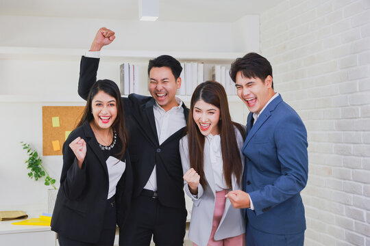 Group of young colleague businessman and businesswoman celebrate successful together in working office, Hands join together teamwork concept