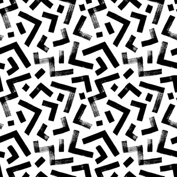 Zigzag and triangle vector seamless pattern. Hand drawn geometric brush strokes. Thick lines with scuffs. Abstract grunge zig zag lines texture, triangles and dashes. Mosaic and maze seamless pattern.