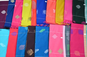 Display of Indian Sarees, Colorful Fancy Sarees in Saree Store, ready to be sell in market. 