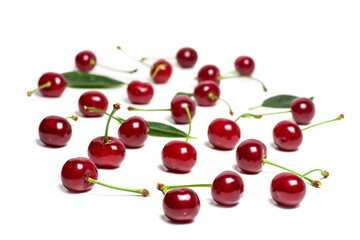 Obraz na płótnie Canvas Cherry isolated. Sour cherry. Cherries with leaves on white background. Sour cherries on white