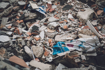Waste plastic bottles and other types of waste at the ground