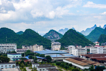 Fototapeta na wymiar City buildings and mountains landscape in Guilin, Guangxi, China