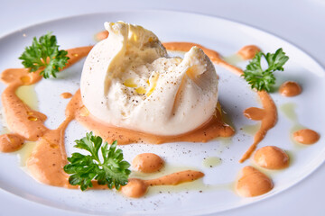 Italian cheese Burratta with tomatoes souse and olive oil