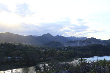 sunset in the mountains near the river