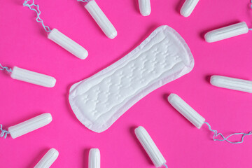 Menstrual tampons and pads on a pink background. Menstruation cycle. Hygiene and protection. copy space