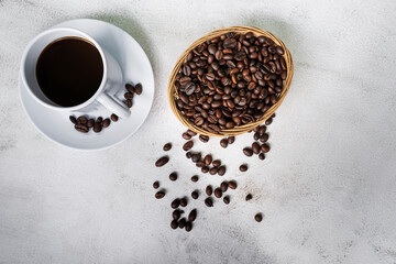 Cup of coffee and coffee beans background. Food and beverage concept.