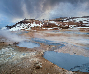 The Namafjall Geothermal Area, Iceland, on the east side of Lake Myvatn. At this area, also known as Hverir, are many smoking fumaroles, boiling mud pots and sulphur crystals.