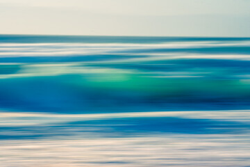 Fototapeta na wymiar Stormy ocean, abstract seascape, motion blur in bright blue colors