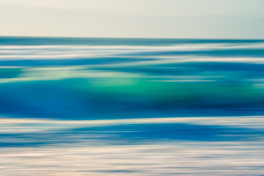 Stormy ocean, abstract seascape, motion blur in bright blue colors