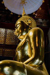 Buddha statue Wat Suthat Thep Wararam is a temple in Bangkok, Thailand, ancient architecture, cultural identity.