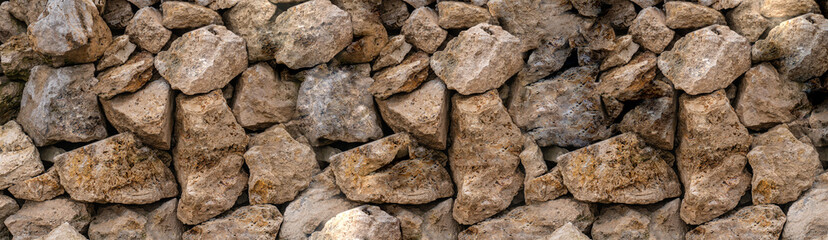 stone texture of uneven brown stones narrow set