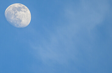 Daytime Moon in clear blue sky 