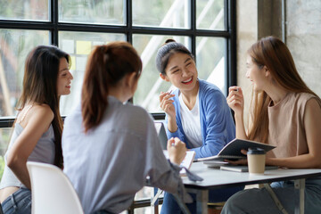 Young creative Asian business woman meeting to plan to work together with new business startup.